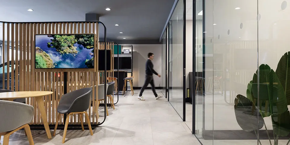 Employee walking through McCoy's offiec